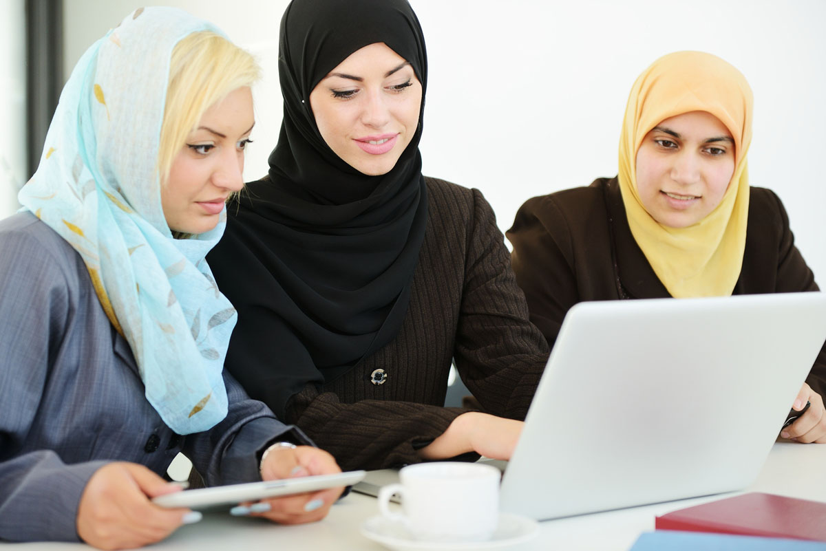 Group of Muslim women working. 