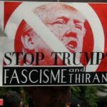 Sejumlah masa yang tergabung dalam front Perjuangan Rakyat membentangkan spanduk dan membawa poster saat melakukan aksi yang mengecam kebijakan Presiden Amerika Serikat Donald Trump di kawasan Bunderan HI, CFD, Jakarta, Minggu (5/2/2017). Dalam aksinya mereka mendesak agar Presiden Donald Trump mencabut kebijakan yang merugikan imigran muslim. AKTUAL/Munzir