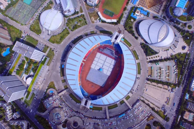 This aerial picture taken on August 7, 2015 shows the Yellow Dragon Sports Center Stadium in Hangzhou, in eastern China. The Chinese city of Hangzhou was on September 16, 2015 awarded the 2022 Asian Games, organisers and China's official state news agency said, as Beijing seeks more international sporting events on its soil. CHINA OUT AFP PHOTO (Photo by AFP) (AFP/STR)