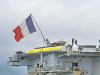 Cegah Eskalasi Maritim, Kapal Induk Prancis Charles de Gaulle Bergerak Menuju Selat Hormuz Illustrasi - Dua awak kapal berada di dekat pesawat jet tempur Rafale yang dibawah oleh kapal Induk Charles de Gaulle (R91) saat bersandar di Pelabuhan Gili Mas, Desa Labuan Tereng, Kecamatan Lembar, Lombok Barat, NTB, Sabtu (1/2/2025). (ANTARA FOTO/Ahmad Subaidi/foc)